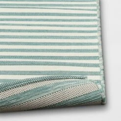 5'x7' Narrow Wornstripe Rectangular Woven Outdoor Area Rug Turquoise Blue - Threshold™ -Threshold Outdoor Deals Store GUEST de24221f eb98 4b3d 8215 da45667ce98e